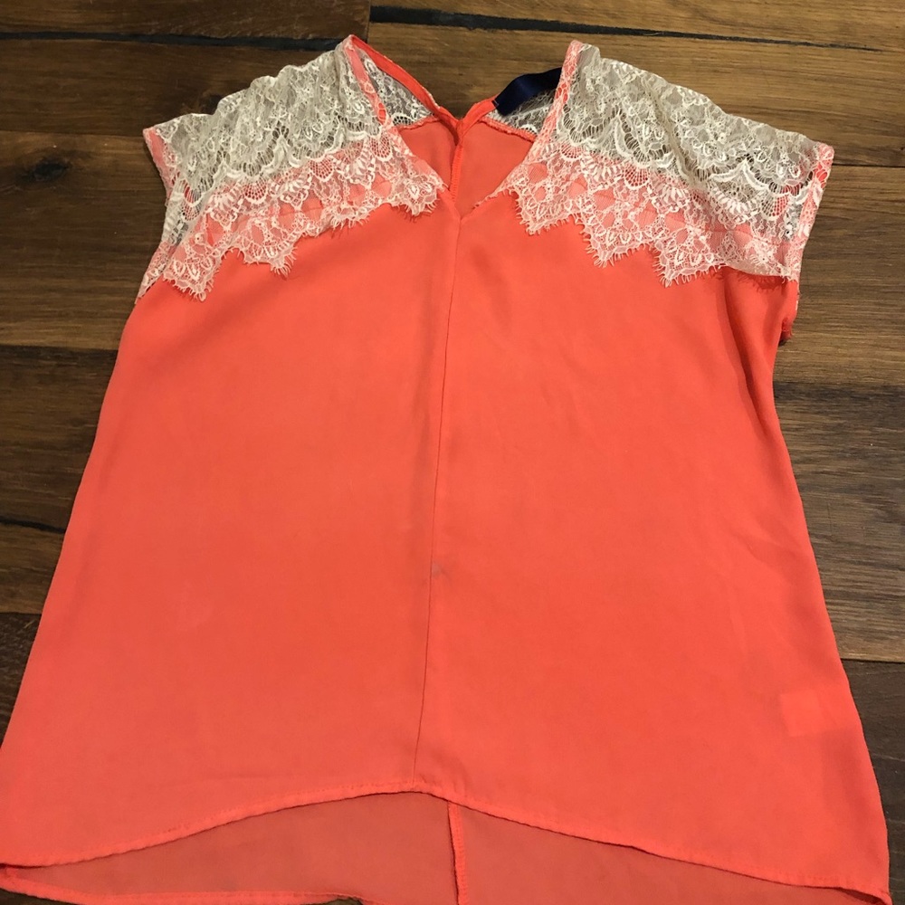 Francesca’s orange and lace blouse